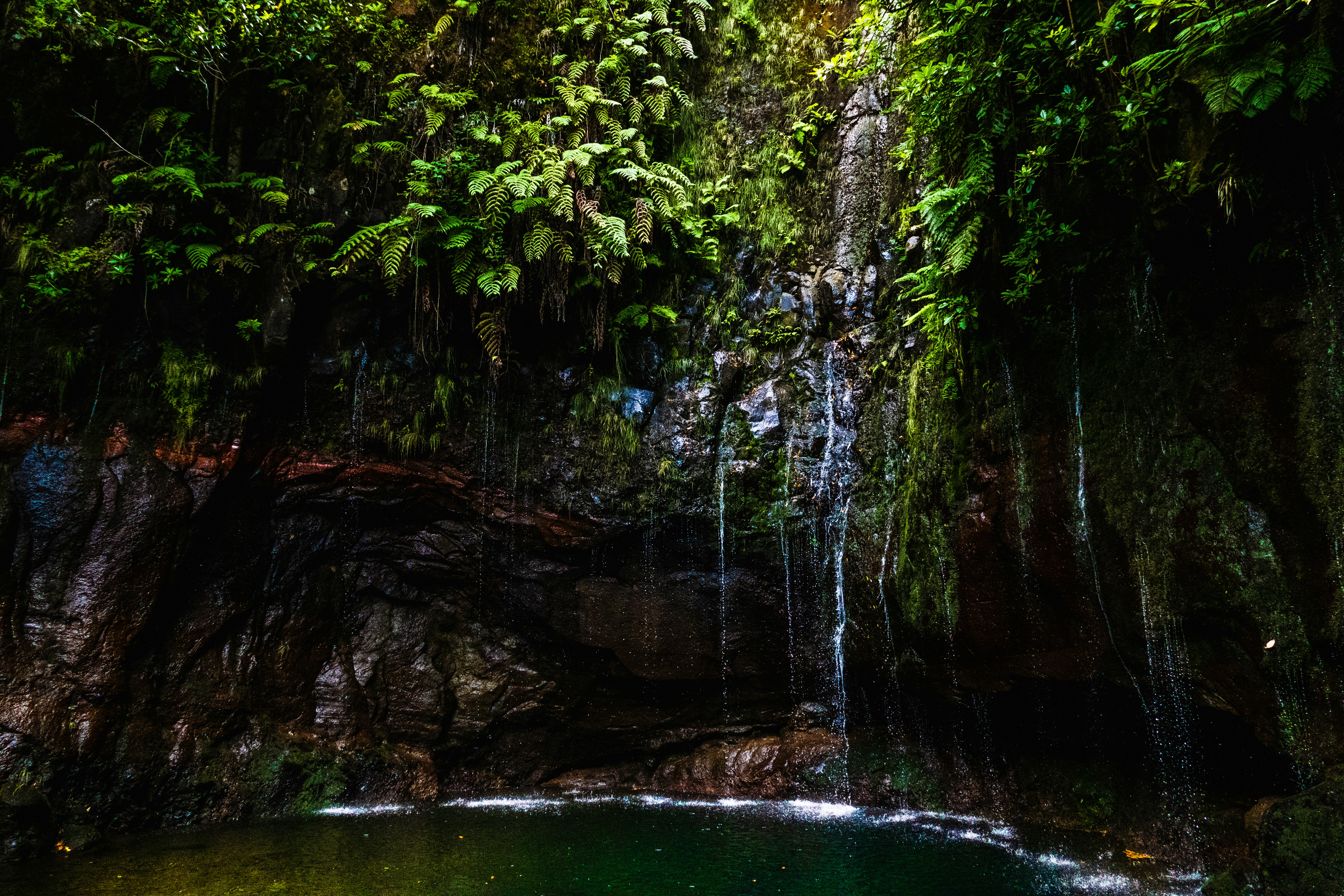 waterfalls cascading into lagoon